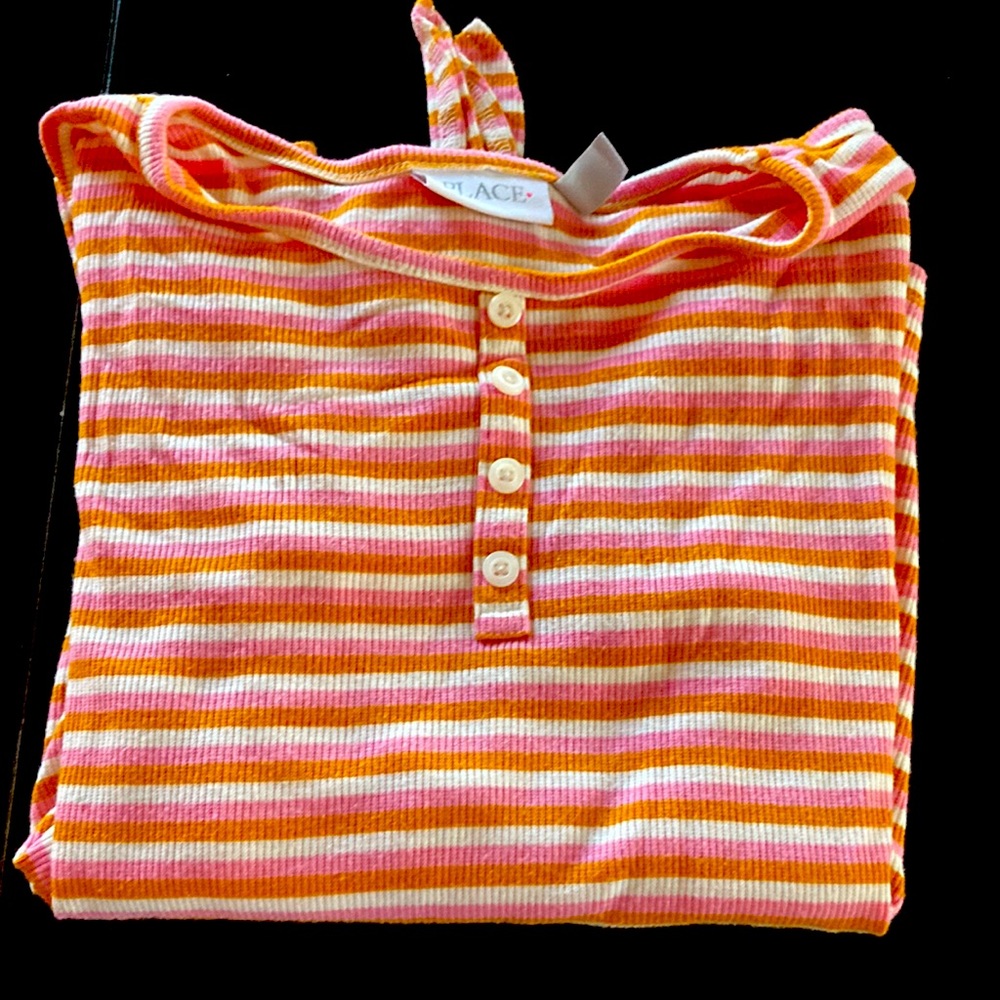 This is a cute long sleeve shirt from place it is a size 14 kids.